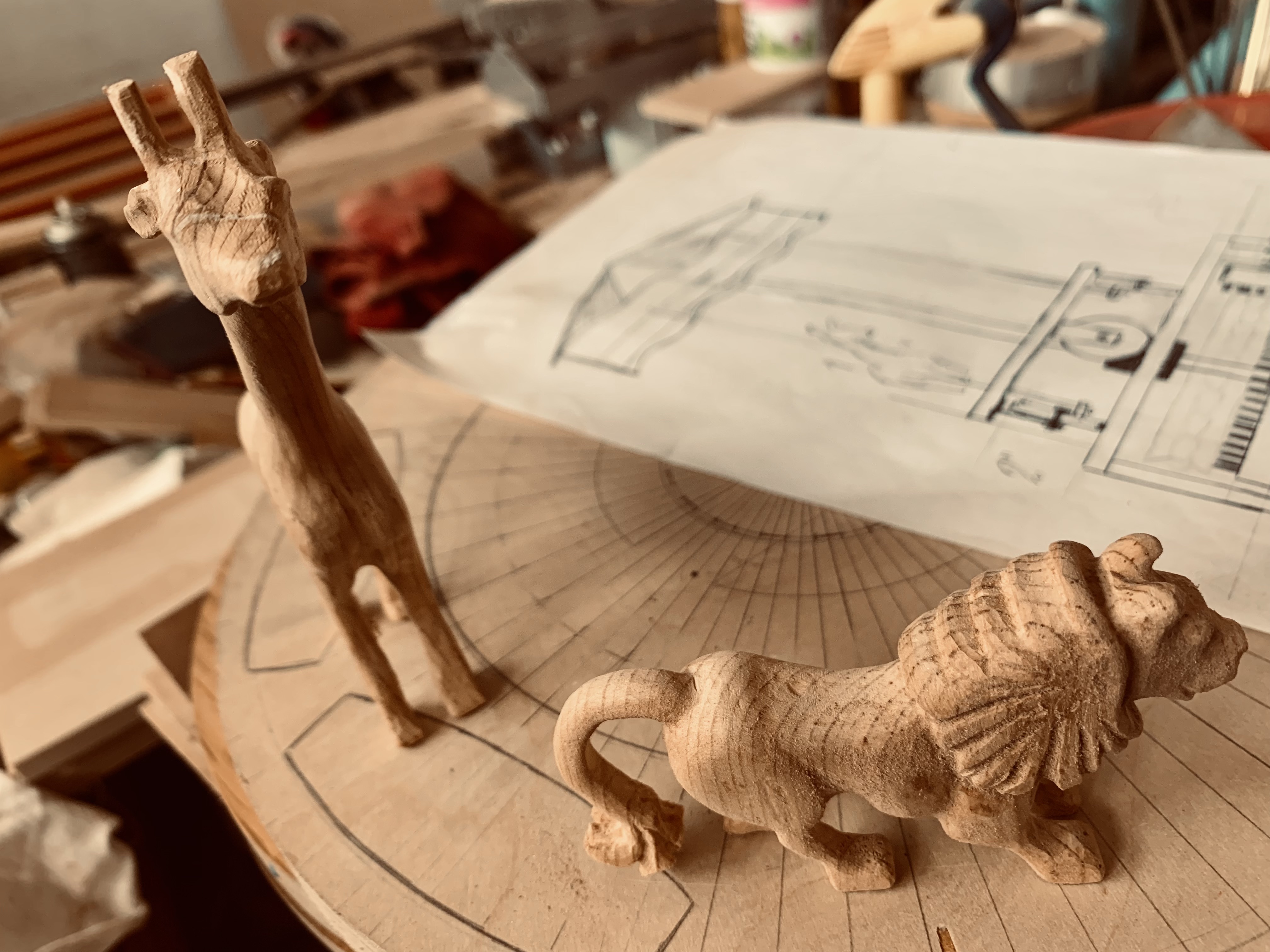 Artist's workshop filled with woodworking tools and warm natural light